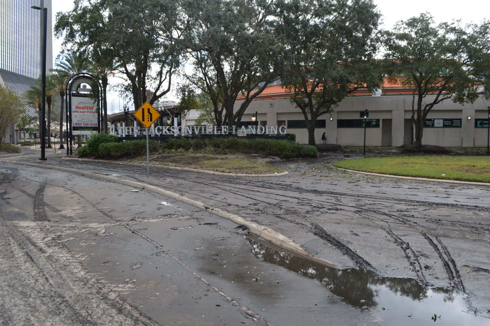Mud and debris lined Water Street near the Jacksonville Landing Tuesday in the wake of historic flooding caused by Hurricane Irma pushing the St. Johns River over the bulkhead.   (Photo by David Cawton)