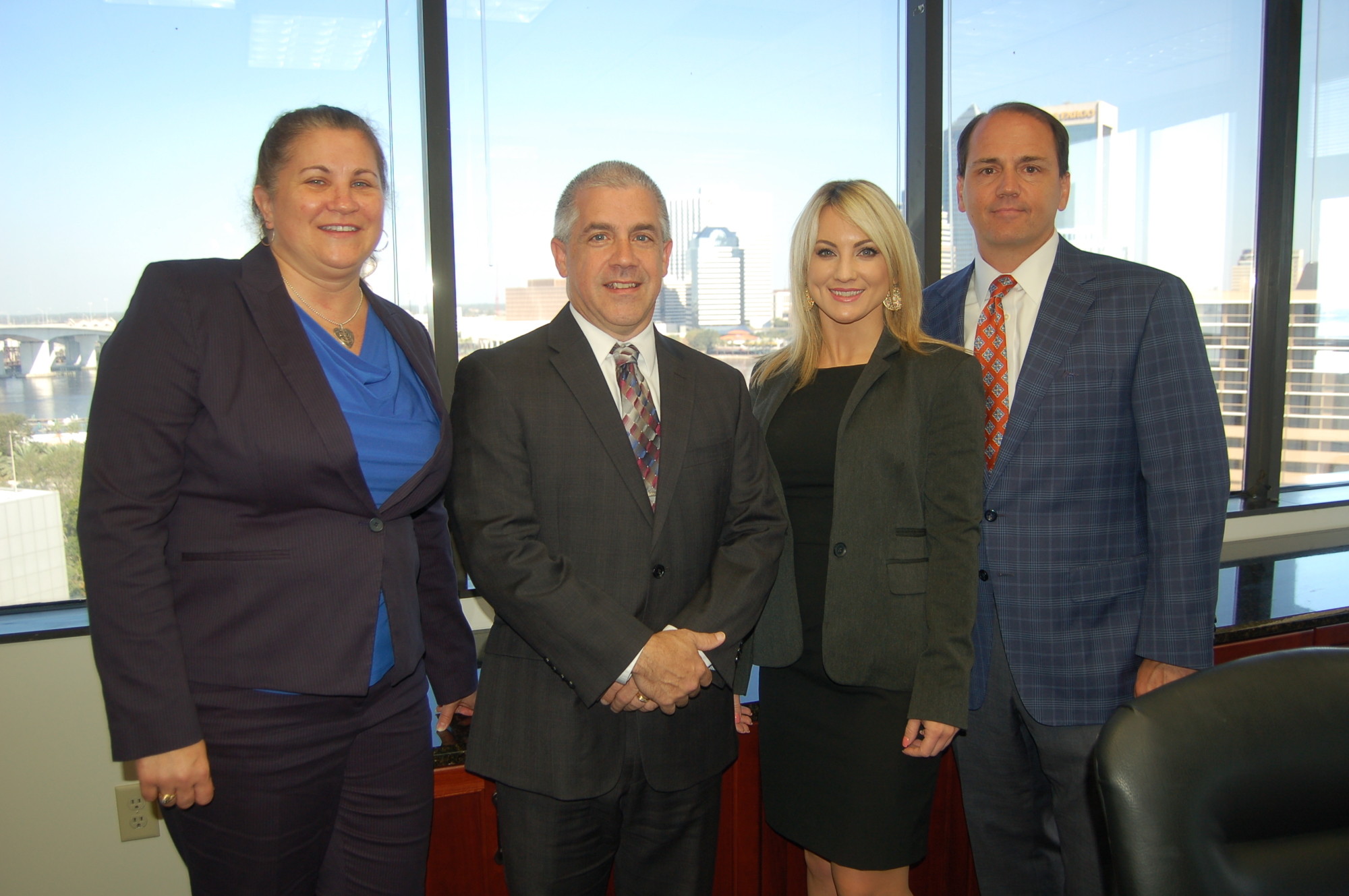 The Jacksonville office of The Truck Accident Law Firm, from left, attorney Heather Solanka, partner Gregg Anderson, attorney Leslie Sloan and Managing Partner Joseph Camerlengo.