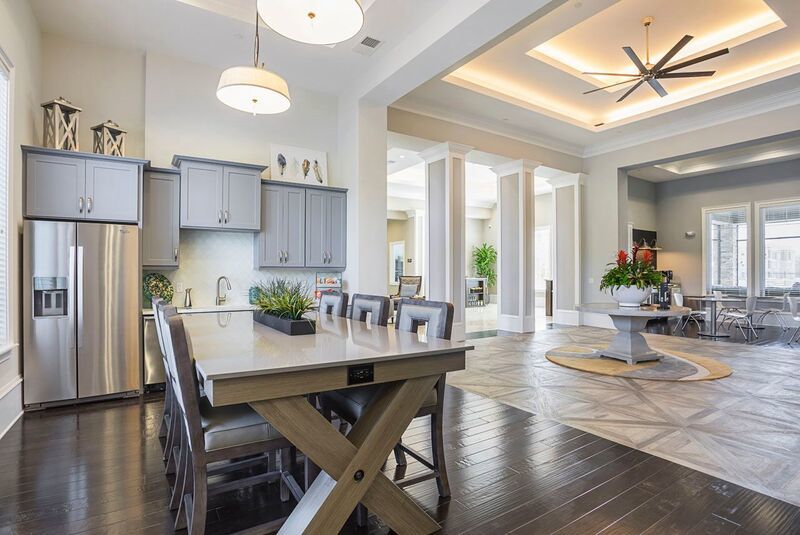 The clubhouse kitchen and coffee bar at The Oasis at Moss Park, an apartment community in Lake Nona developed by Picerne Real Estate Group of Altamonte Springs.