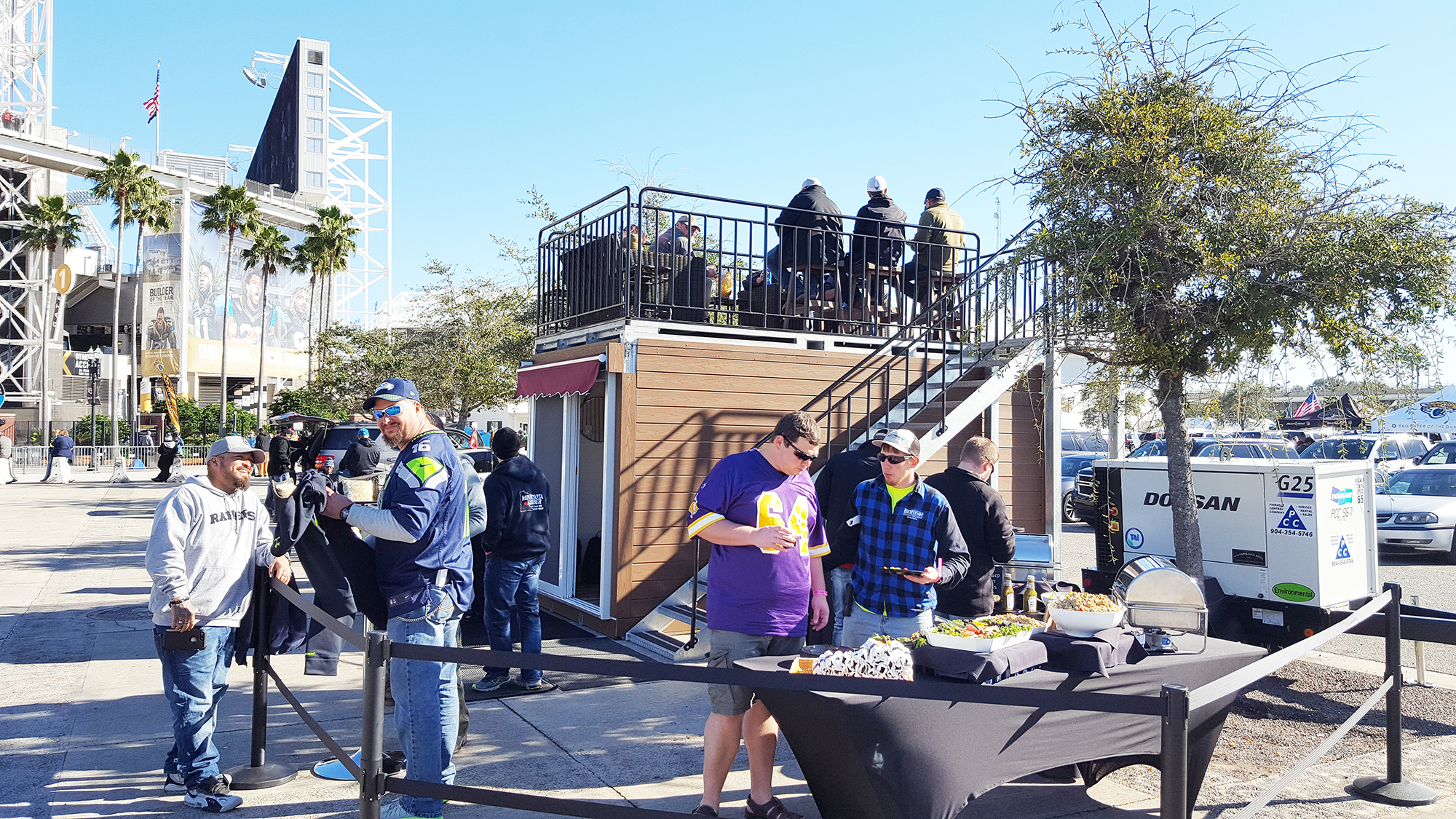 Fans tailgate outside EverBank Field using Party Suite’s portable Entertainment Suite. The unit is 16 feet long and 8 feet wide.