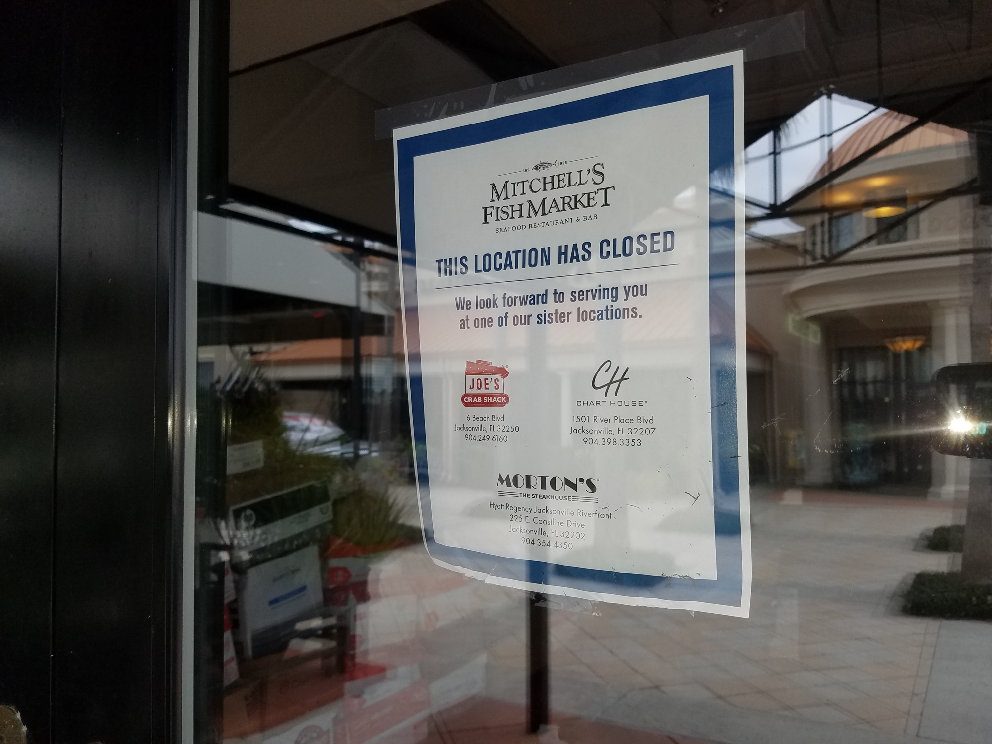 A sign on the door of Mitchell’s Fish Market directs customers to Landry’s other restaurants in town: Joe’s Crab Shack, Chart House and Morton’s The Steakhouse