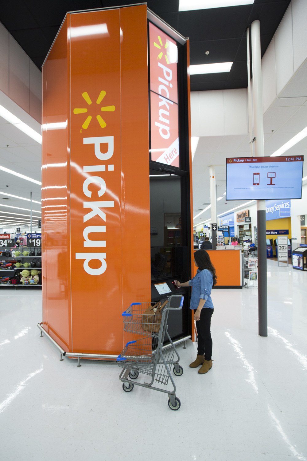 Walmart's 16-foot-tall Pickup Towers function like high-tech vending machines.