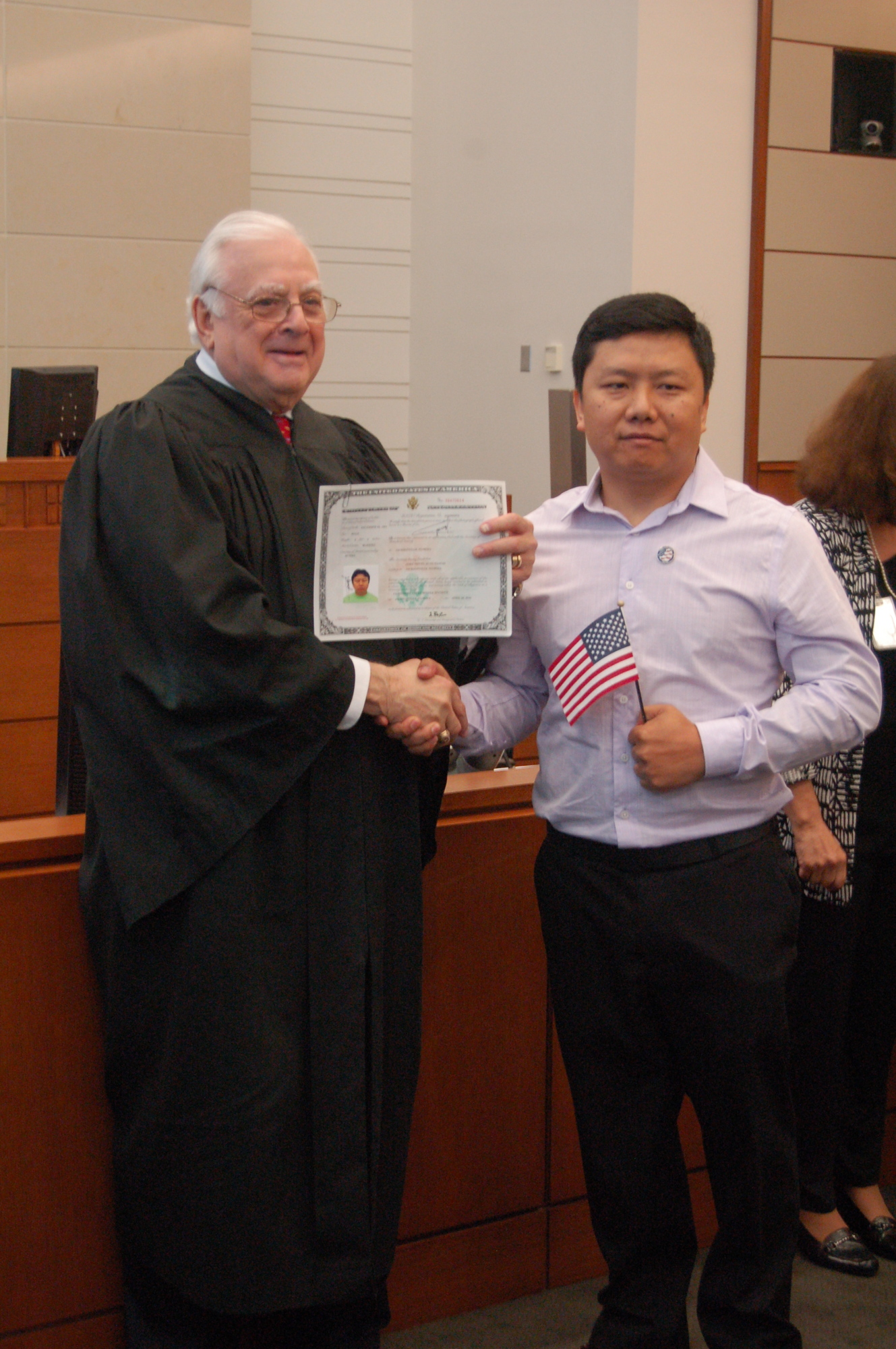 Senior U.S. District Judge Harvey Schlesinger presided at the ceremony and presented a certificate to each new citizen.