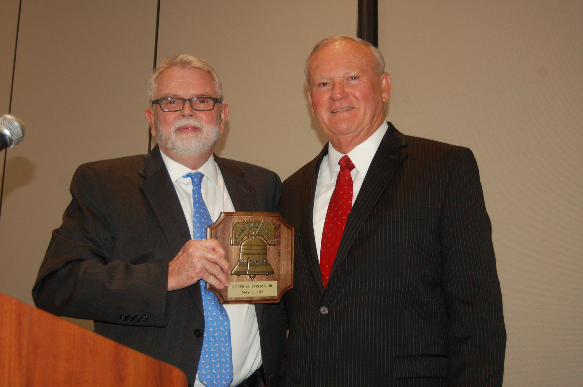 Fourth Judicial Circuit Chief Judge Mark Mahon, left, presented the 2018 Liberty Bell Award to Trial Court Administrator Joe Stelma.