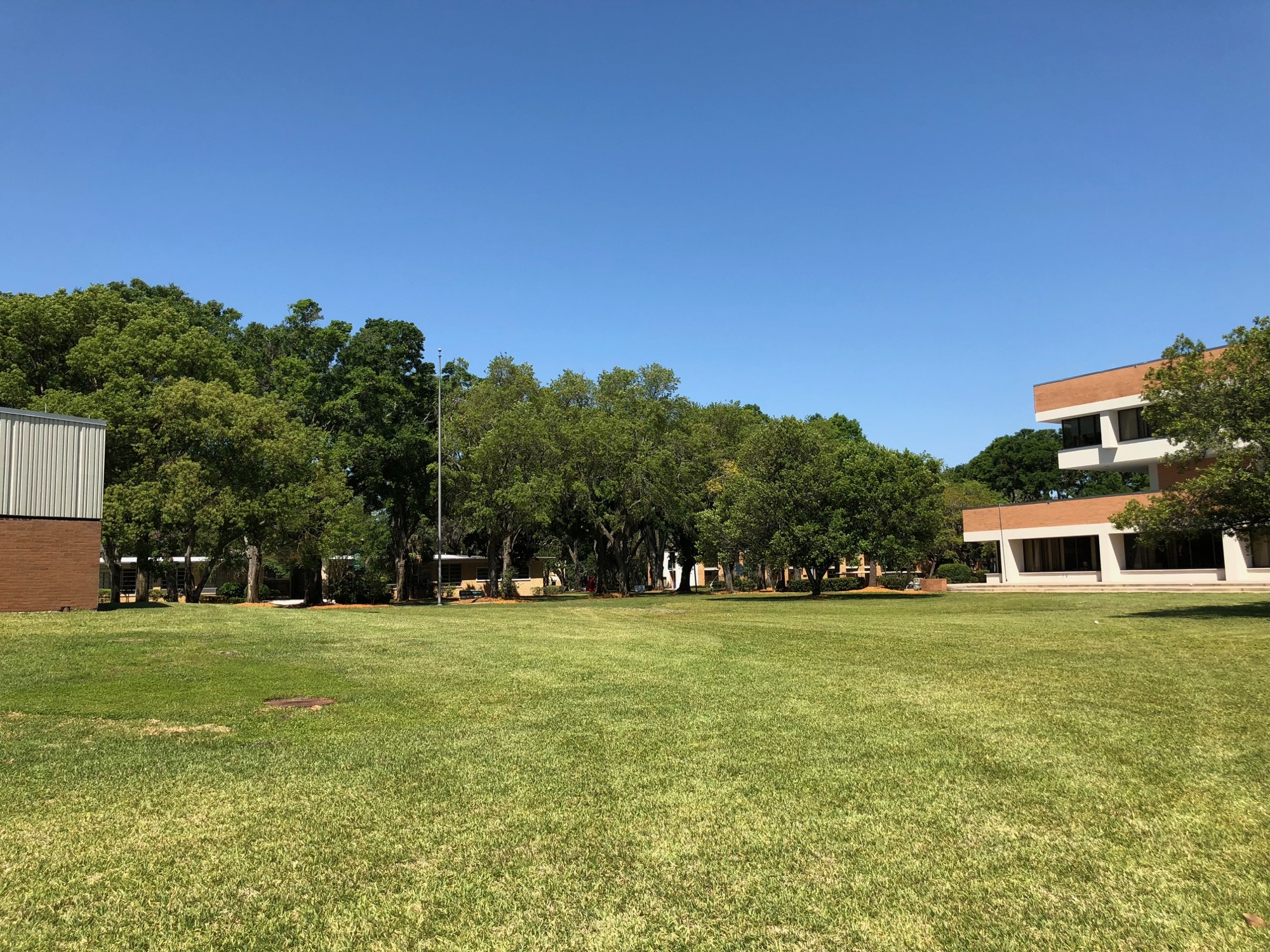 The $4 million, 12,000-square-foot Welcome Center is planned between the J. Arthur Howard Administration Building (right) and the J. Henry Gooding Building at the Arlington campus at 2800 University Blvd. N.