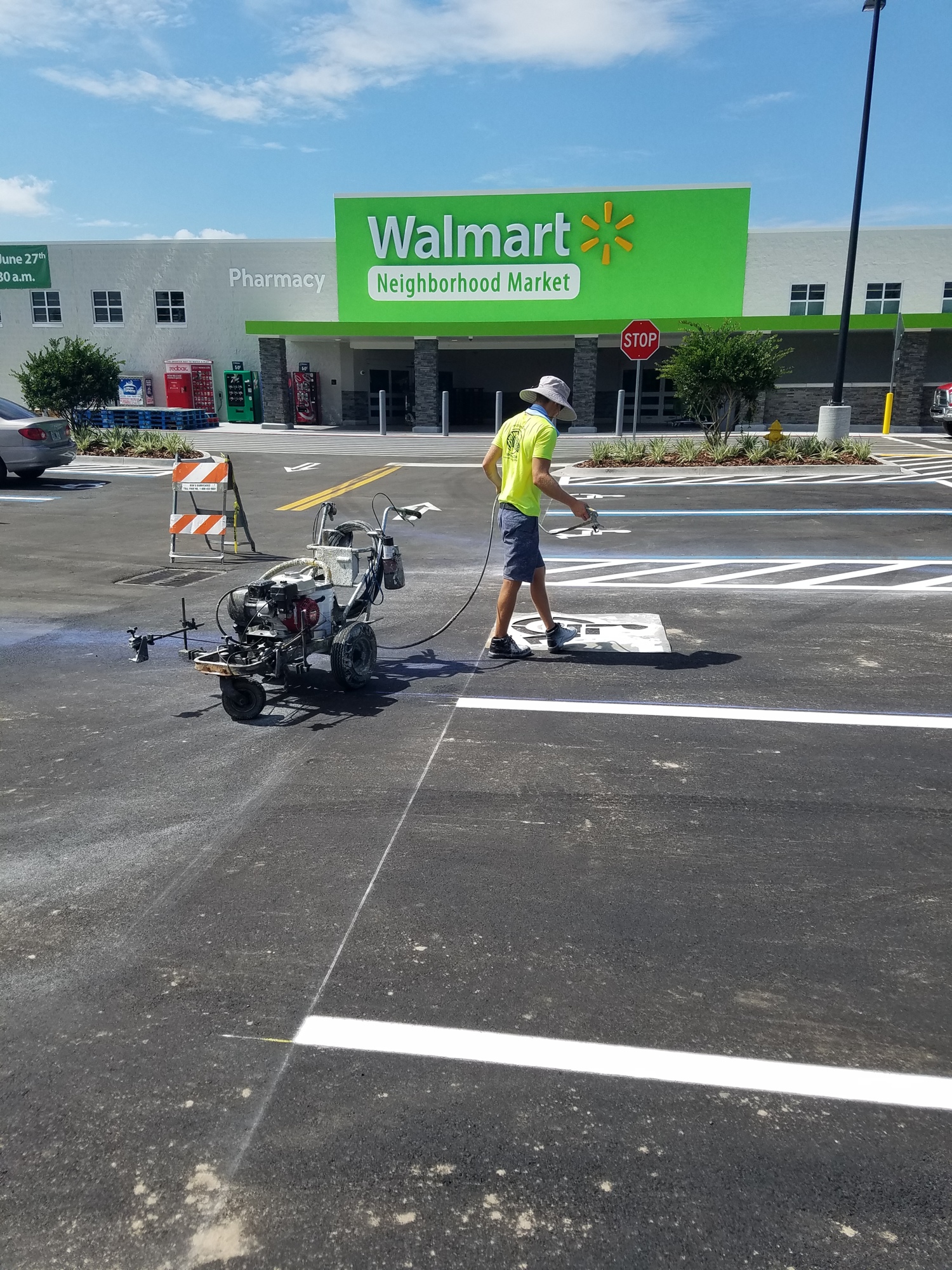 The parking lot at the Walmart Neighborhood Market is stripped in preparation for Wednesday's opening.