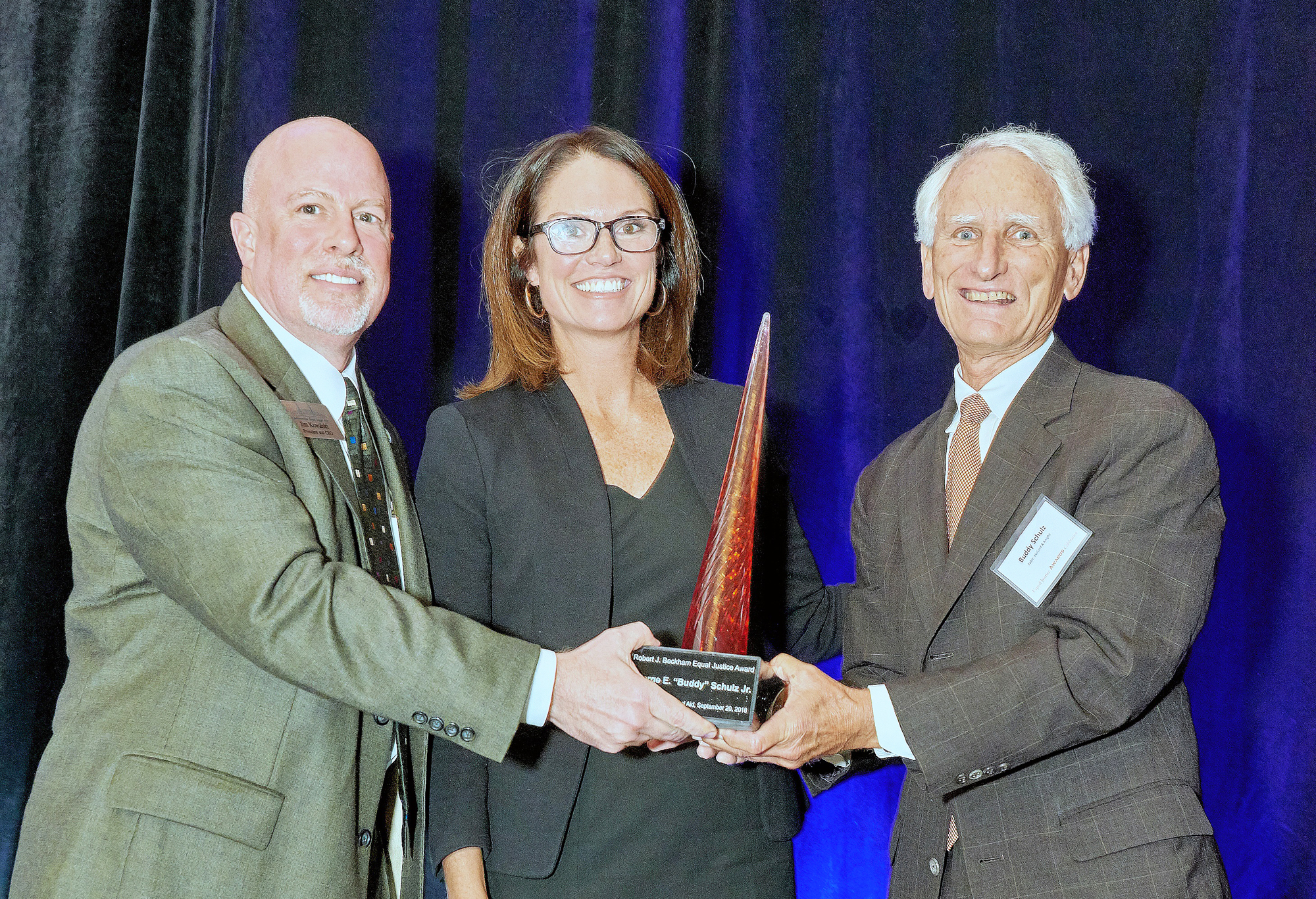 Jacksonville Area Legal Aid Executive Director Jim Kowalski, left, with State Attorney Melissa Nelson and Equal Justice Award recipient Buddy Schulz.