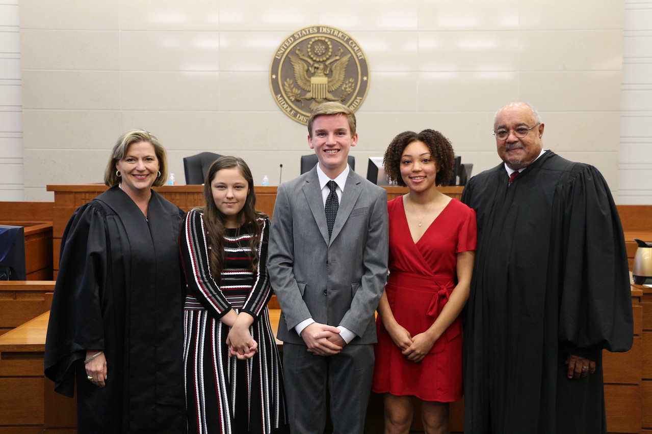 From left, U.S. District Judge Marcia Morales Howard; 2018 High School Essay Contest winners Alayna Weslynn Ledford, Joshua Fahlgren and Taina Garcia; and U.S. District Judge Brian Davis.