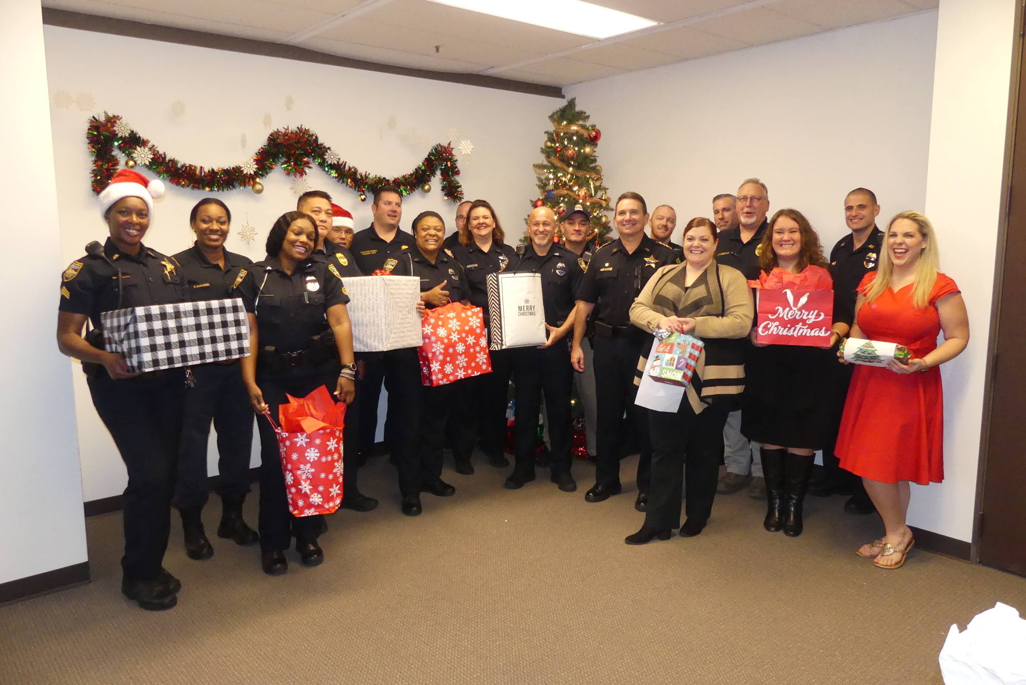 Sheriff Mike Williams and a squad of volunteers from the Jacksonville Sheriff’s Office mustered at the Jacksonville Bar Association’s office to pick up gifts donated by attorneys and law firms for the annual JBA Holiday Project.
