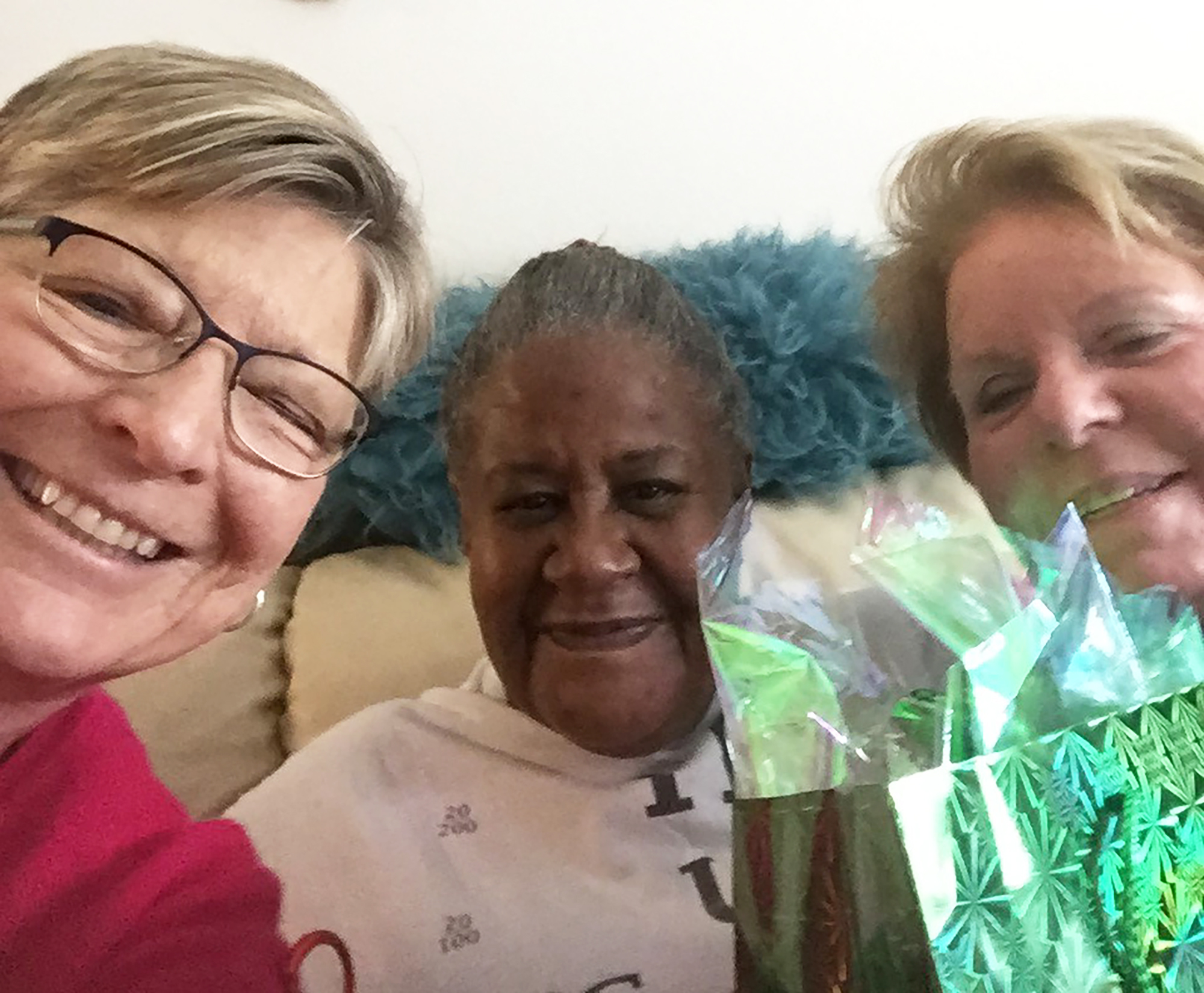 GrayRobinson staff members Calah Campbell, left, and Nancy Lynch delivered gifts to senior Pamela Morris.