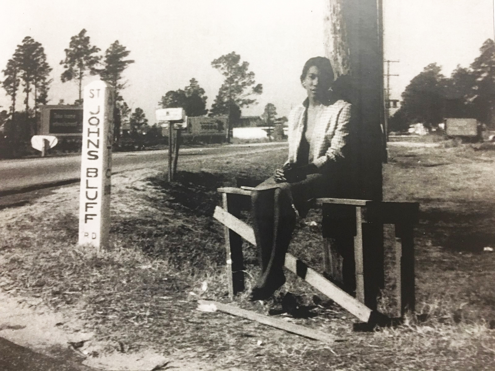 This photograph, from about 1952, shows a young woman on a bench built by her father so she would have a place to sit while waiting for a bus. The photograph inspired the Jacksonville Jaycees to install about 1,200 benches.