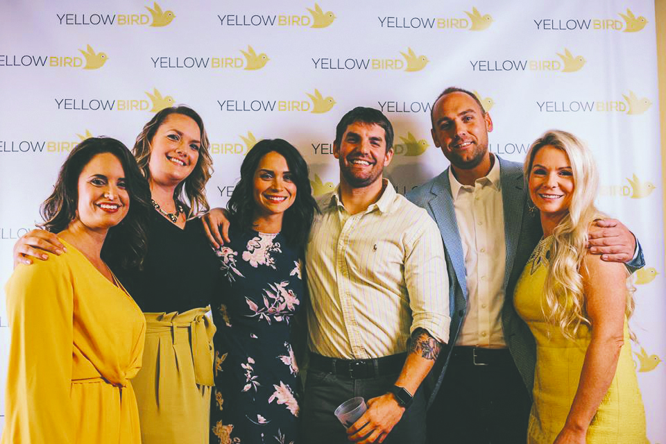 YellowBird Home Buyers employees pose for a photo at the company’s launch party Jan. 4 at Manifest Distilling in Downtown Jacksonville.