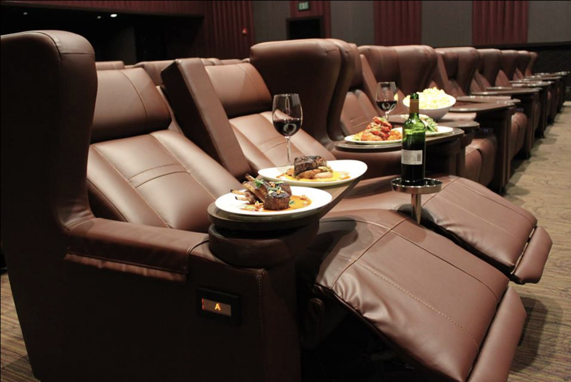 At CineBistro, patrons can watch the latest blockbuster seated on “ultra-luxurious, roomy high-back leather rocking chairs or recliners” while sipping on a $54 bottle of wine. Bottles at the Tampa CineBistro start at $25.