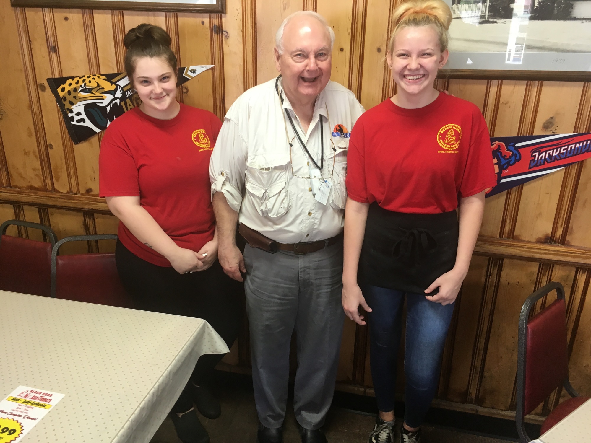 Kenneth Ferger with waitresses (left) Krista Lynch and Alysha Lynch. The women are sisters.