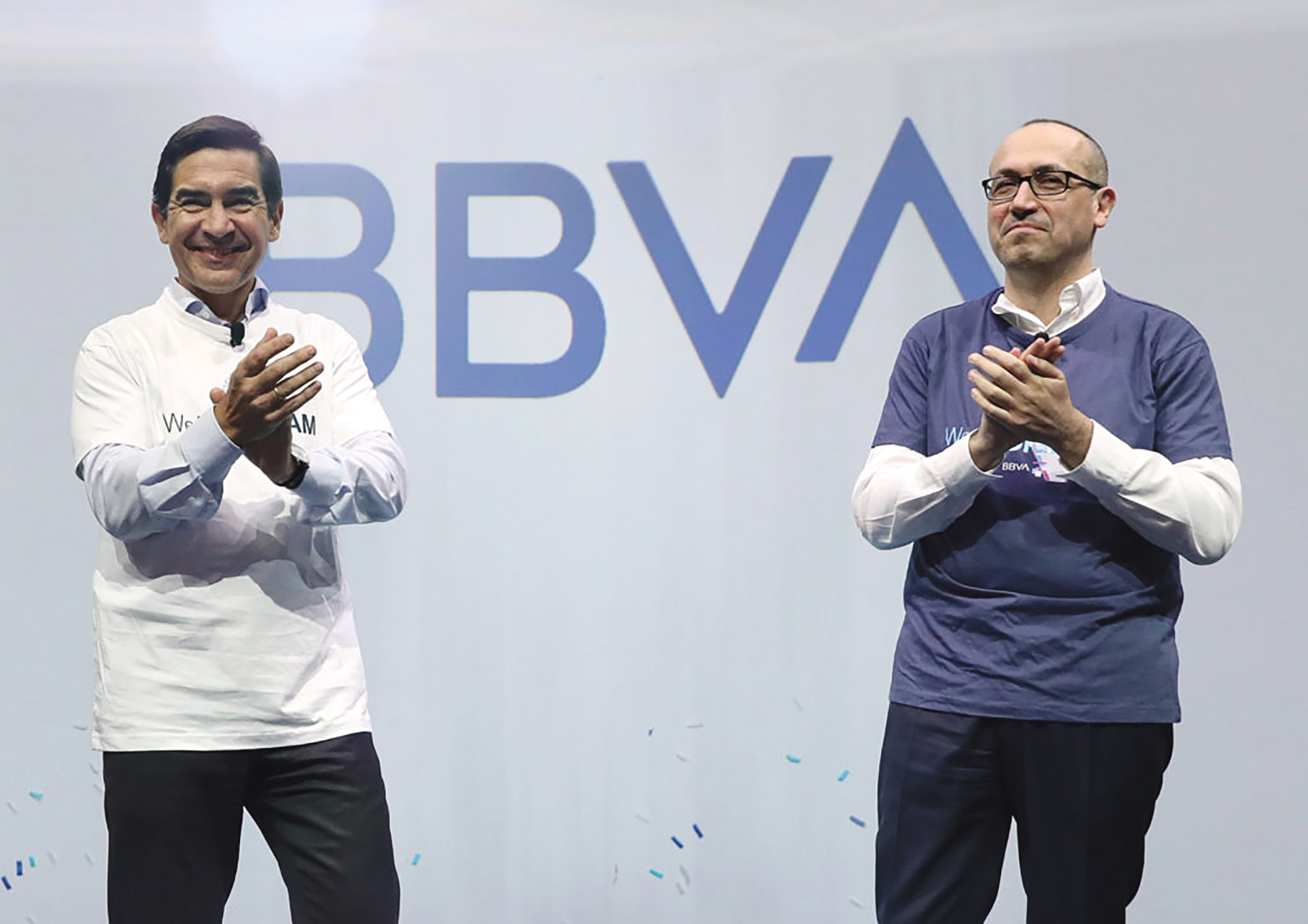 Left, BBVA Group Executive Chairman Carlos Torres Vila and BBVA CEO Onur Genc unveil the bank’s new logo.