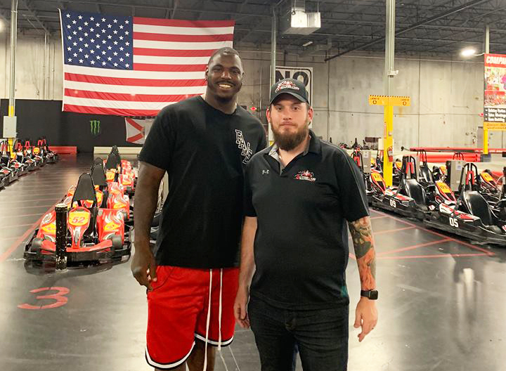 Operations Director Donald Wagner with Malik Jackson at the Autobahn Indoor Speedway & Events in Southside.
