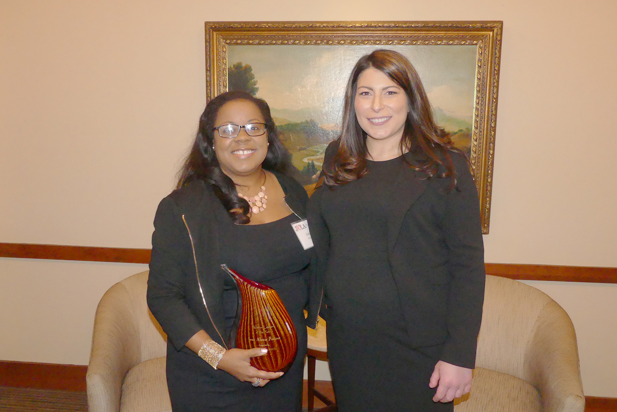 Jacksonville Women Lawyers Association Lawyer of the Year Joni Poitier, left, and JWLA President Jamie Karpman.