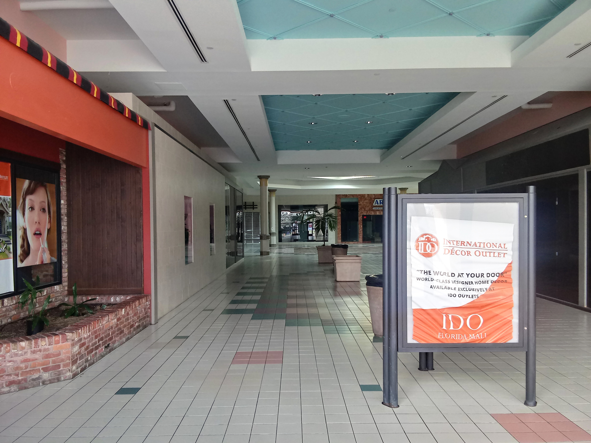 An International Decor sign inside a closed area of Regency Square Mall.