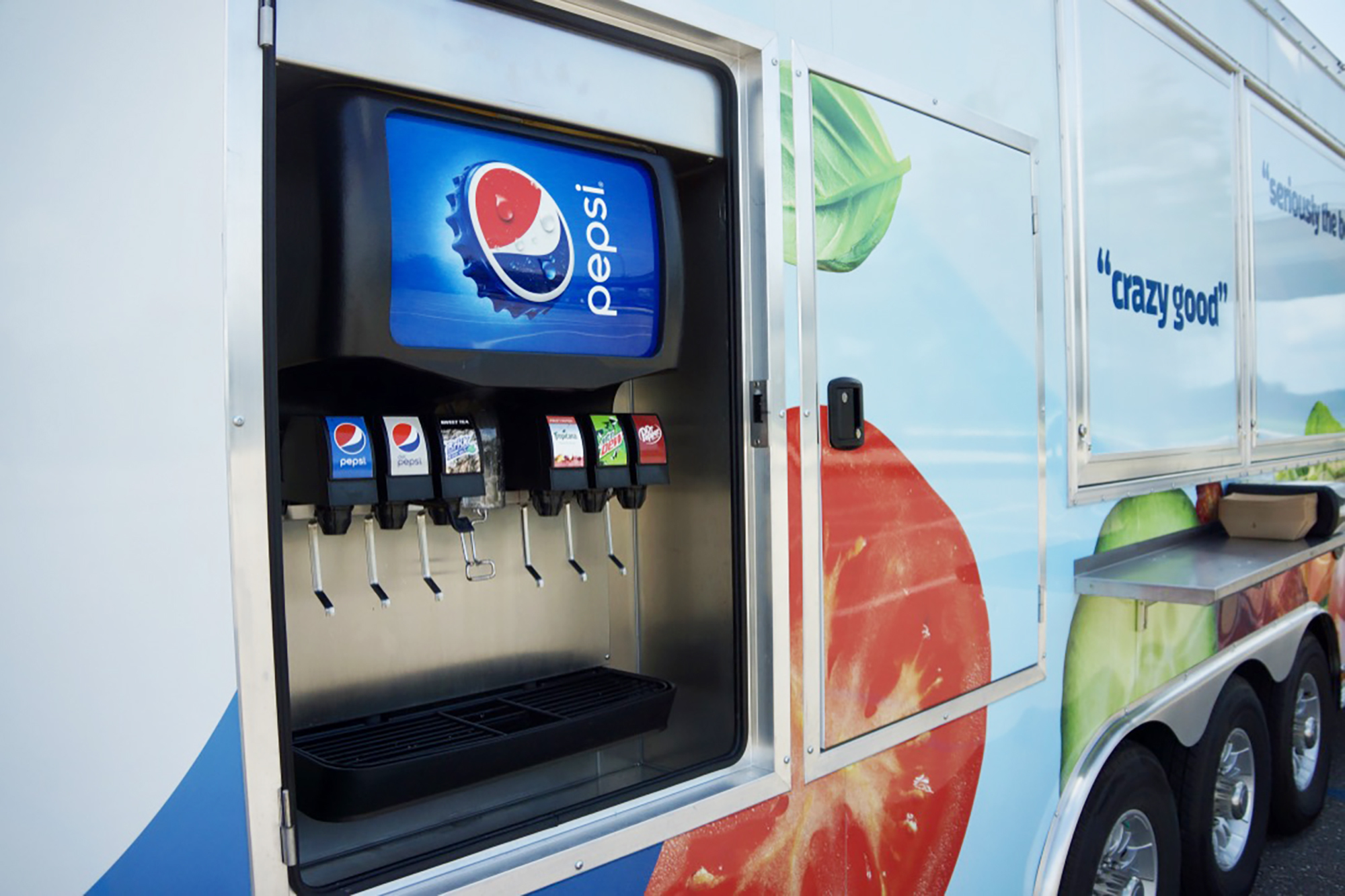 The outside of the truck features two fountain drink stations.