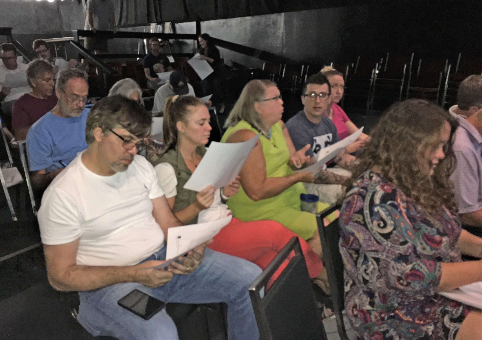 Murray Hill residents look over a site plan of the proposed project that Vestcor distributed before the meeting.