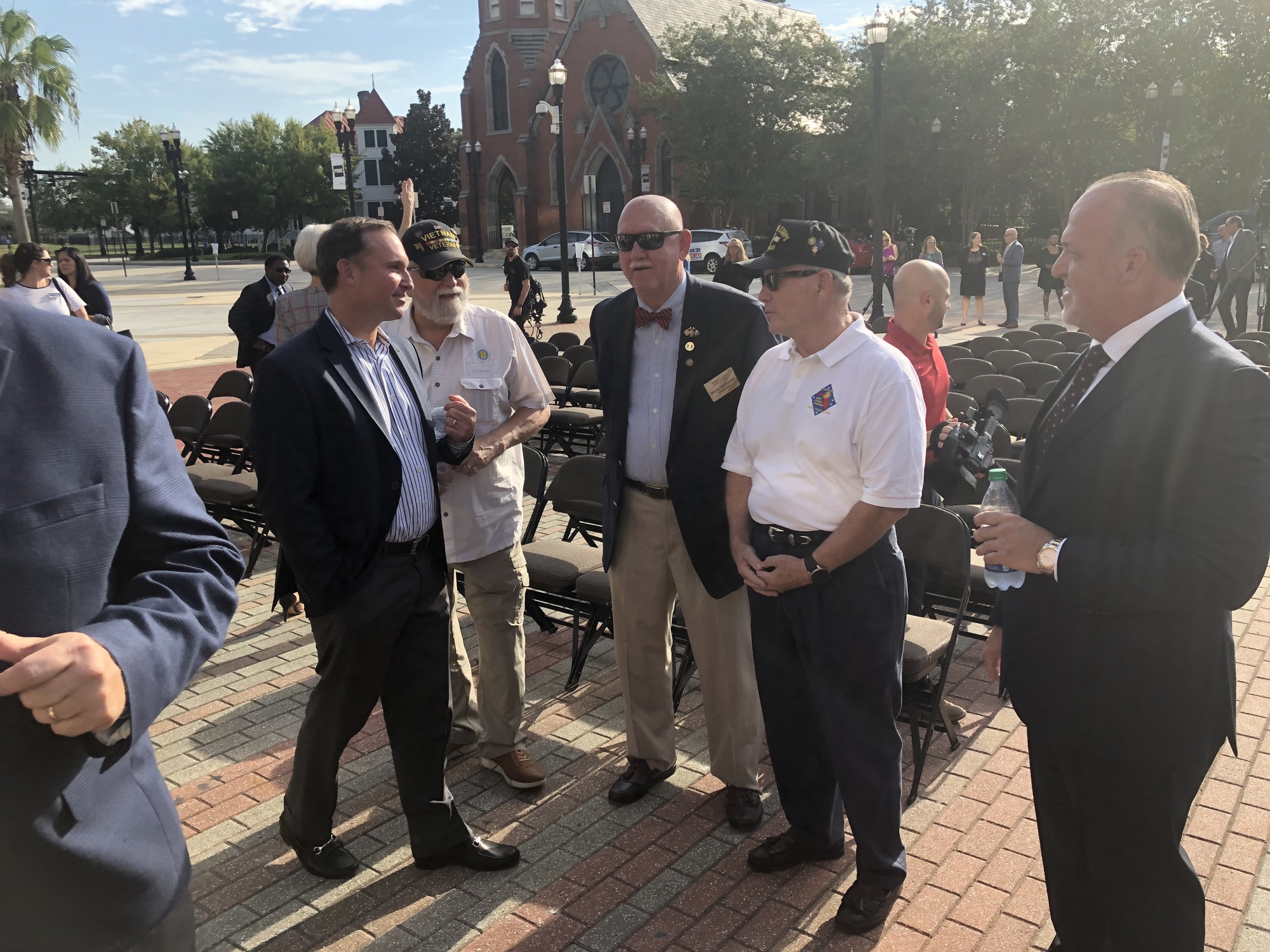Jacksonville Mayor Lenny Curry meets with veterans during the sign unveiling ceremony,