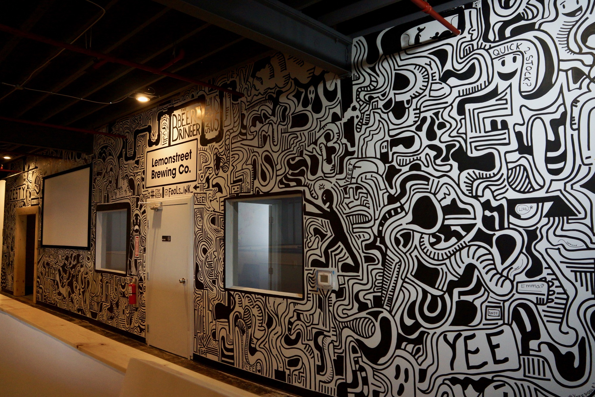 Artist Fools Ink completed the mural on the back wall of the brewery as the first customers arrived last week.