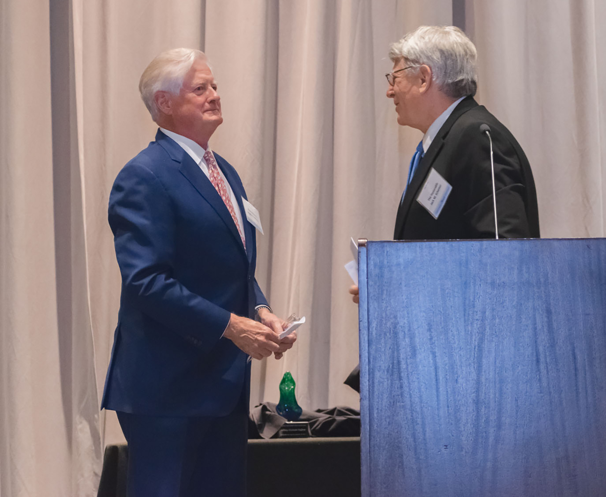 Retired 4th Circuit Judge Hugh Carithers, left, accepted Jacksonville Area Legal Aid’s 2019 Robert J. Beckham Equal Justice Award from Circuit Judge Jack Schemer.