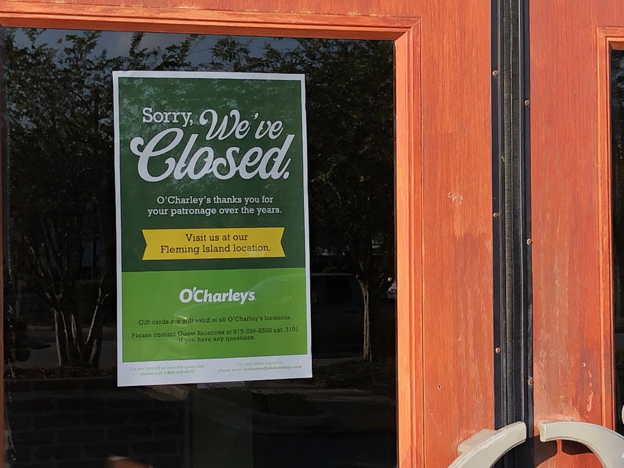 The sign on the door of the Regency O’Charley’s tells customers to visit the Fleming Island location.