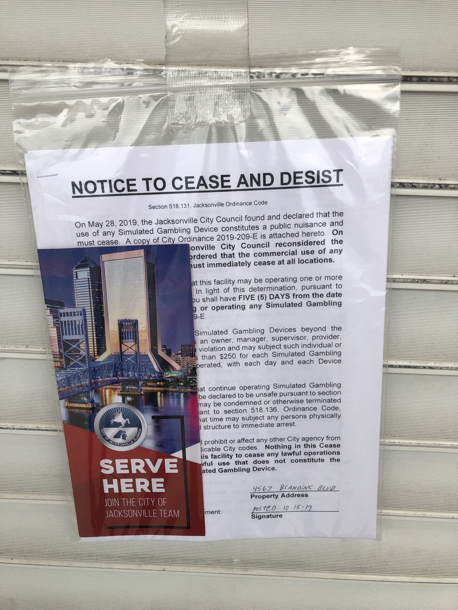 A cease-and-desist letter hangs on the door of the Wynn Zone Internet and Office Services on Blanding Boulevard.