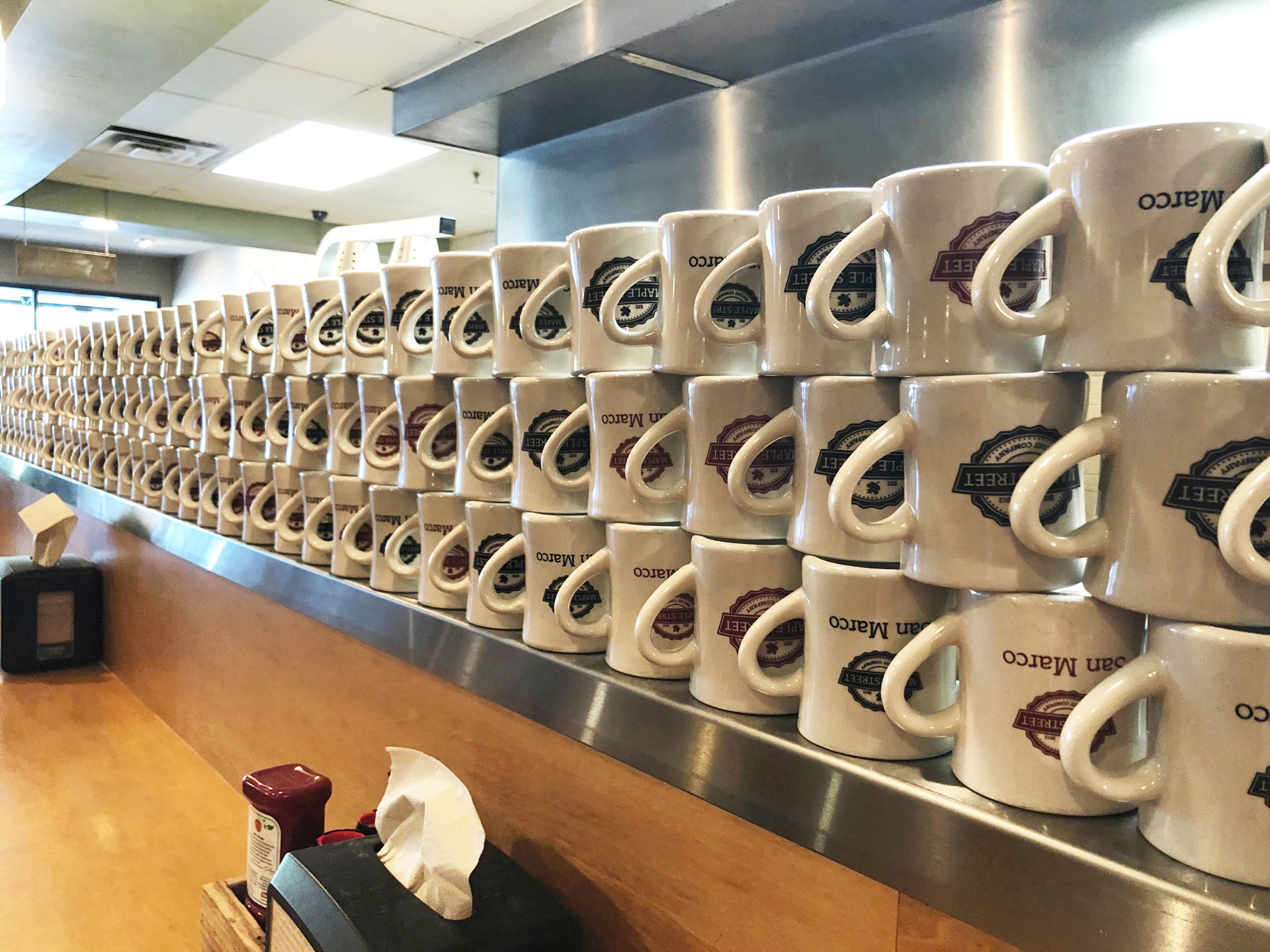 Coffee cups line the counter at the San Marco restaurant.