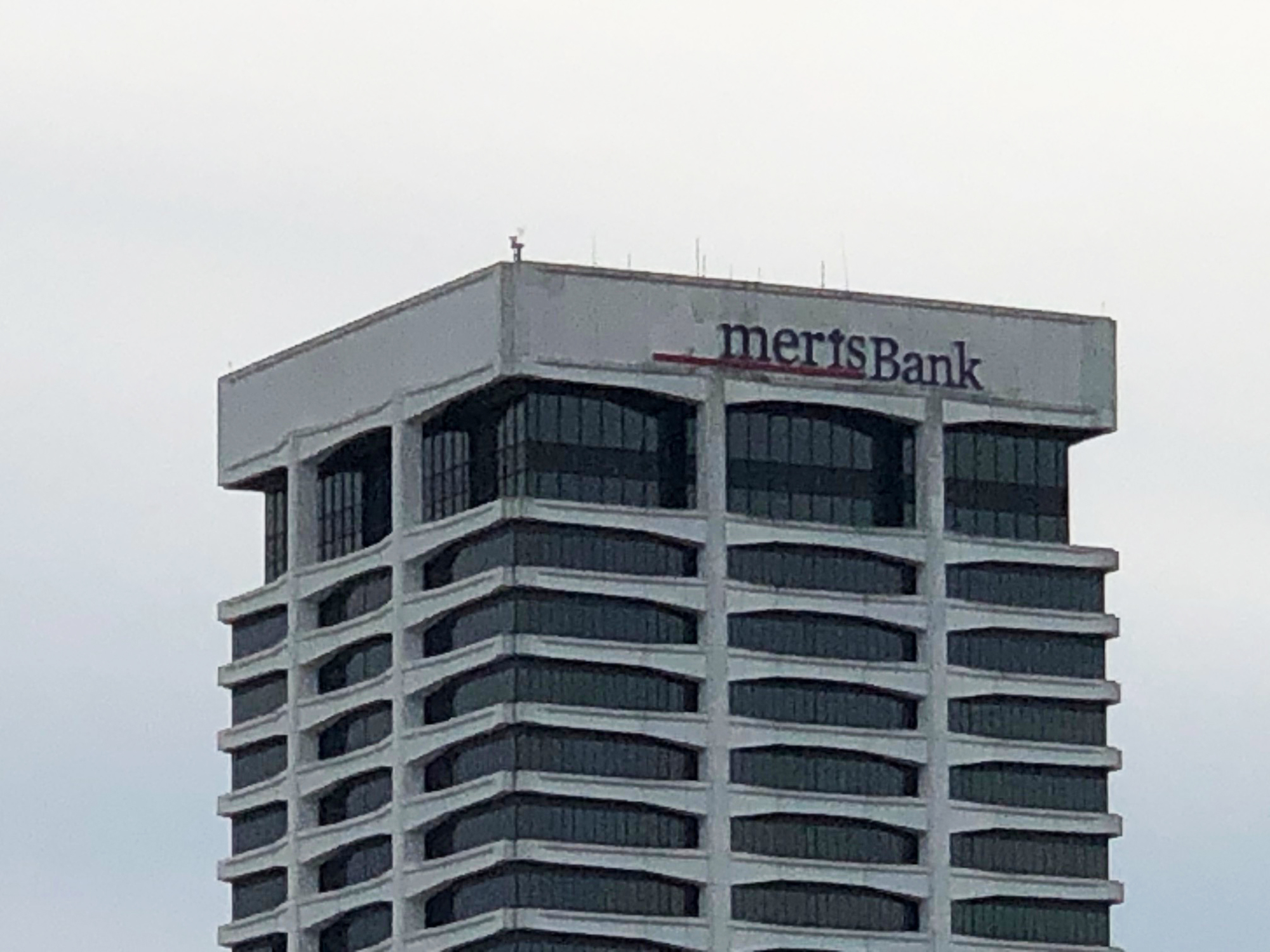 Workers were removing the Ameris Bank sign Thursday.