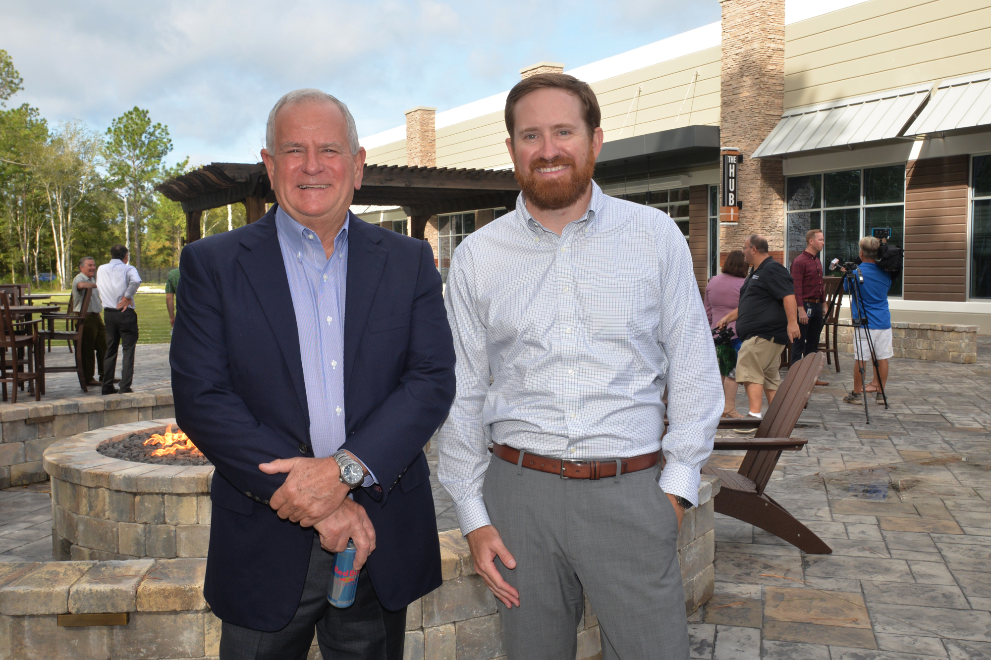 Earl Benton and his son, Jacob, at the grand opening of the new Champion Brands headquarters. Jacob Benton is the general manager at Champion Brands and is designated to succeed his father, who is president and CEO.