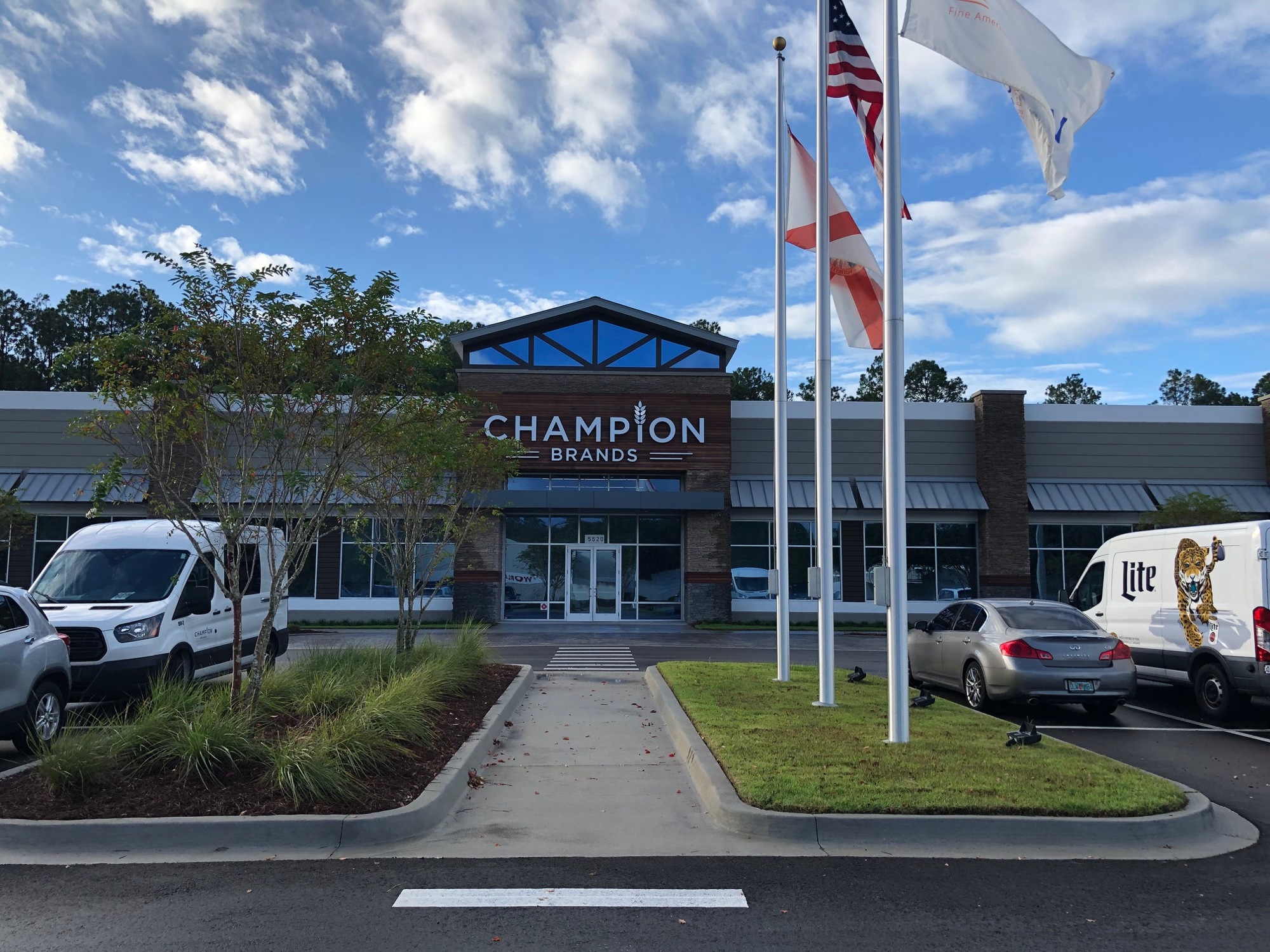 Champion Brands celebrated the grand opening of its new headquarters at 5520 Florida Mining Blvd. S. last week.