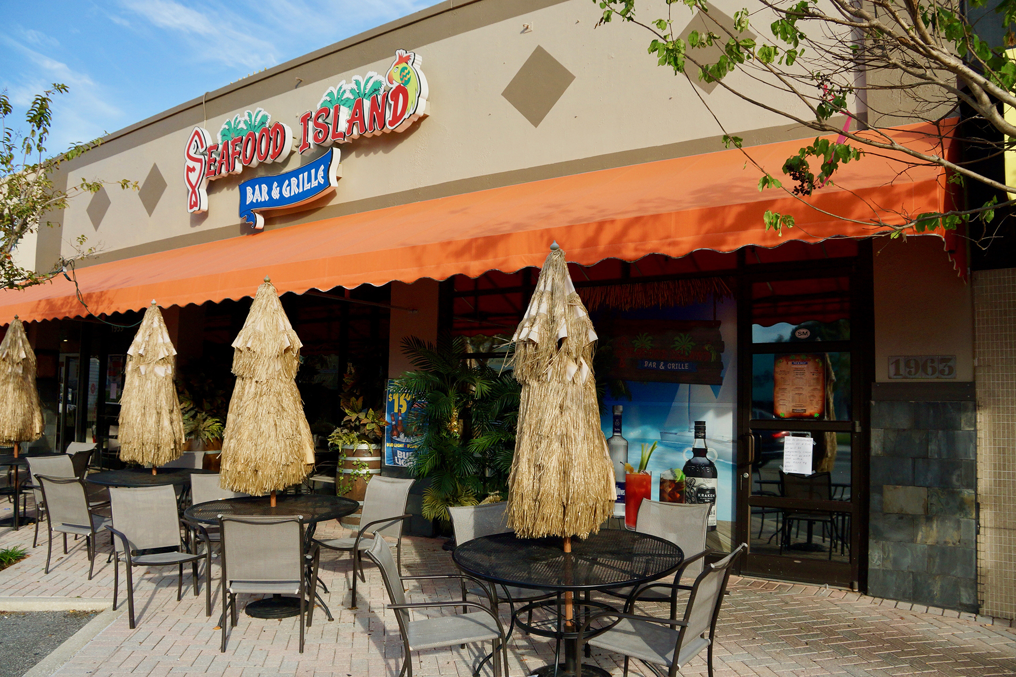 Seafood Island Bar and Grille posted signs on its door that it would reopen on Wednesday