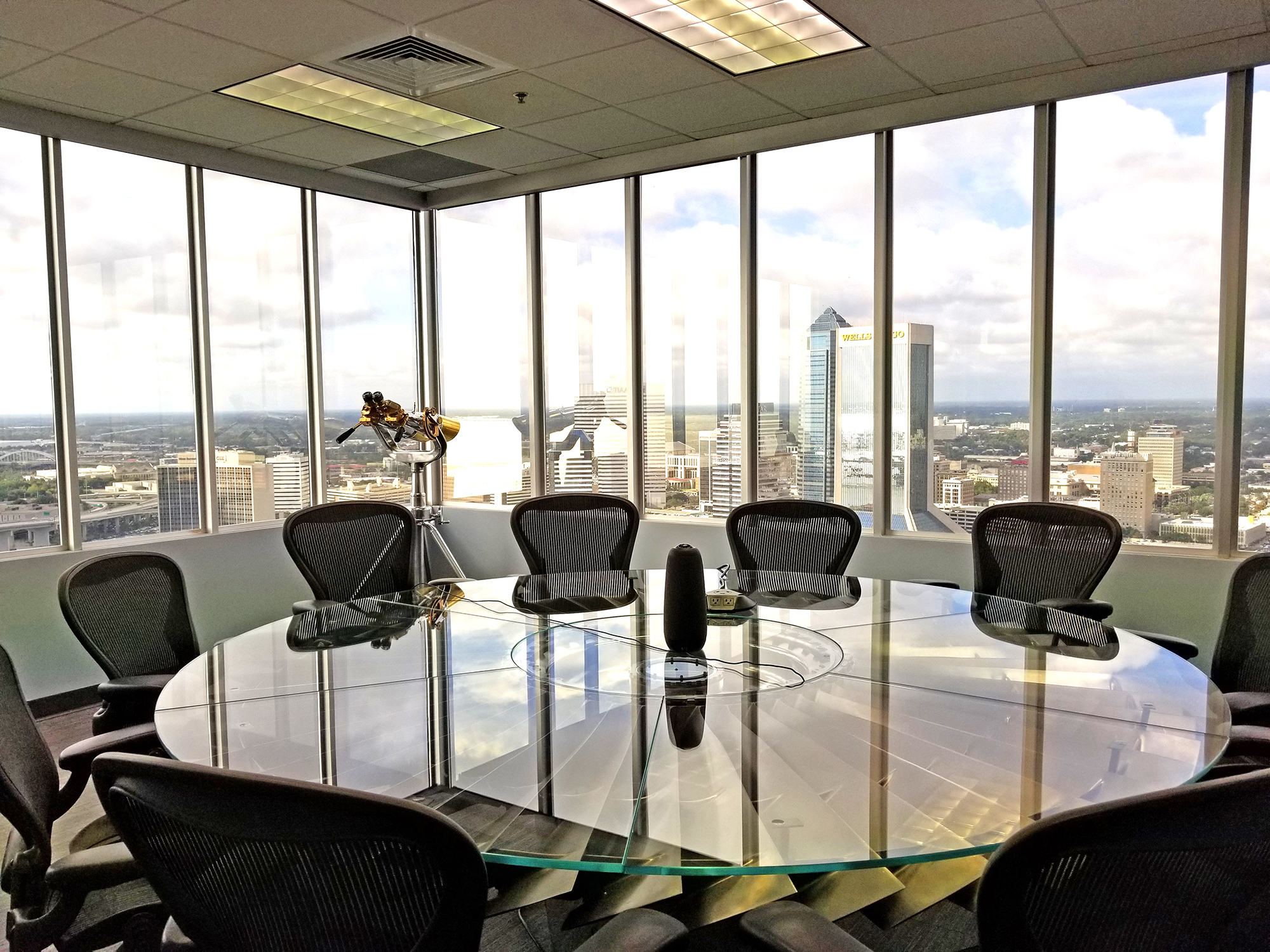 The Finxact meeting room features views of Downtown and a table built on a turbofan from a Boeing 747 engine.