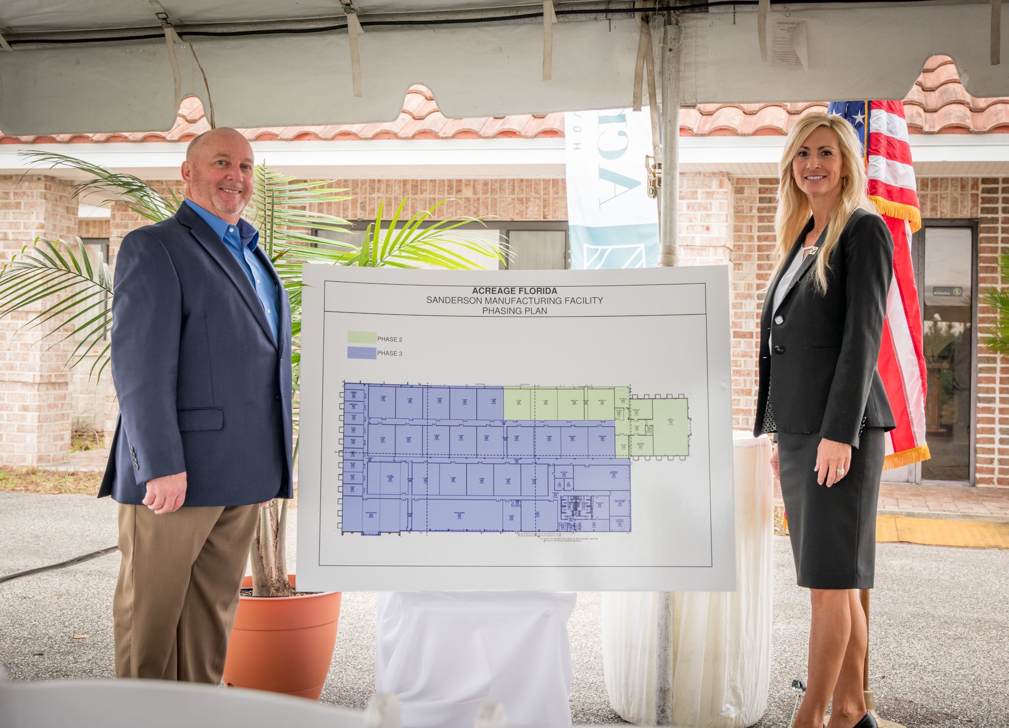 Darryl Register, executive director of the Baker County Chamber of Commerce, and Acreage Holdings General Manager of Florida Rhonda Kratz show the plans for the cannabis production facility.