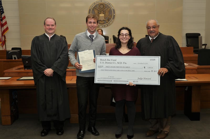 From left, U.S. District Judge Timothy Corrigan; Jason Poole, a teacher at Fleming Island High School; Fleming Island student Inéz Anais Nieves Suarez; and U.S. District Judge Brian Davis.