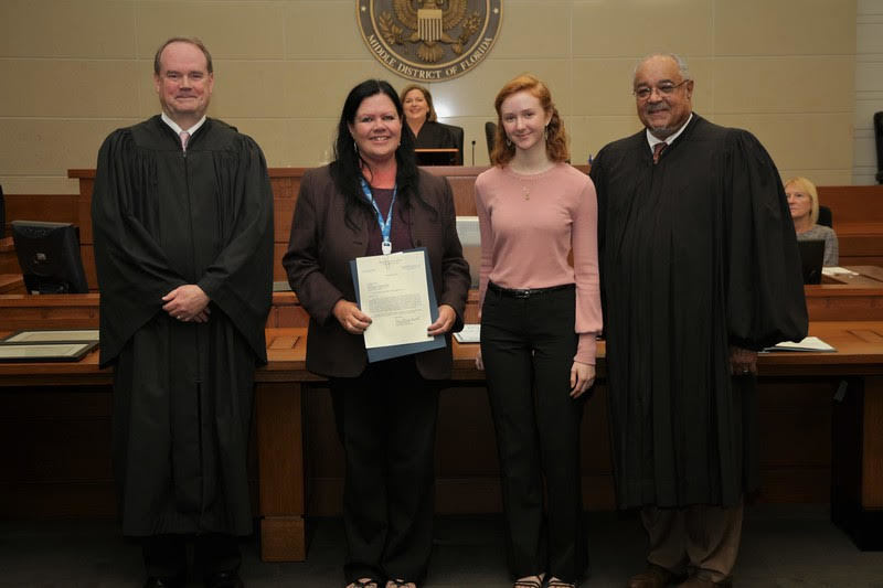 From left, U.S. District Judge Timothy Corrigan; Mary Webster, a teacher at Paxon School of Advanced Studies; Paxon student Marissa Ann Cochran Norton; and U.S. District Judge Brian Davis.