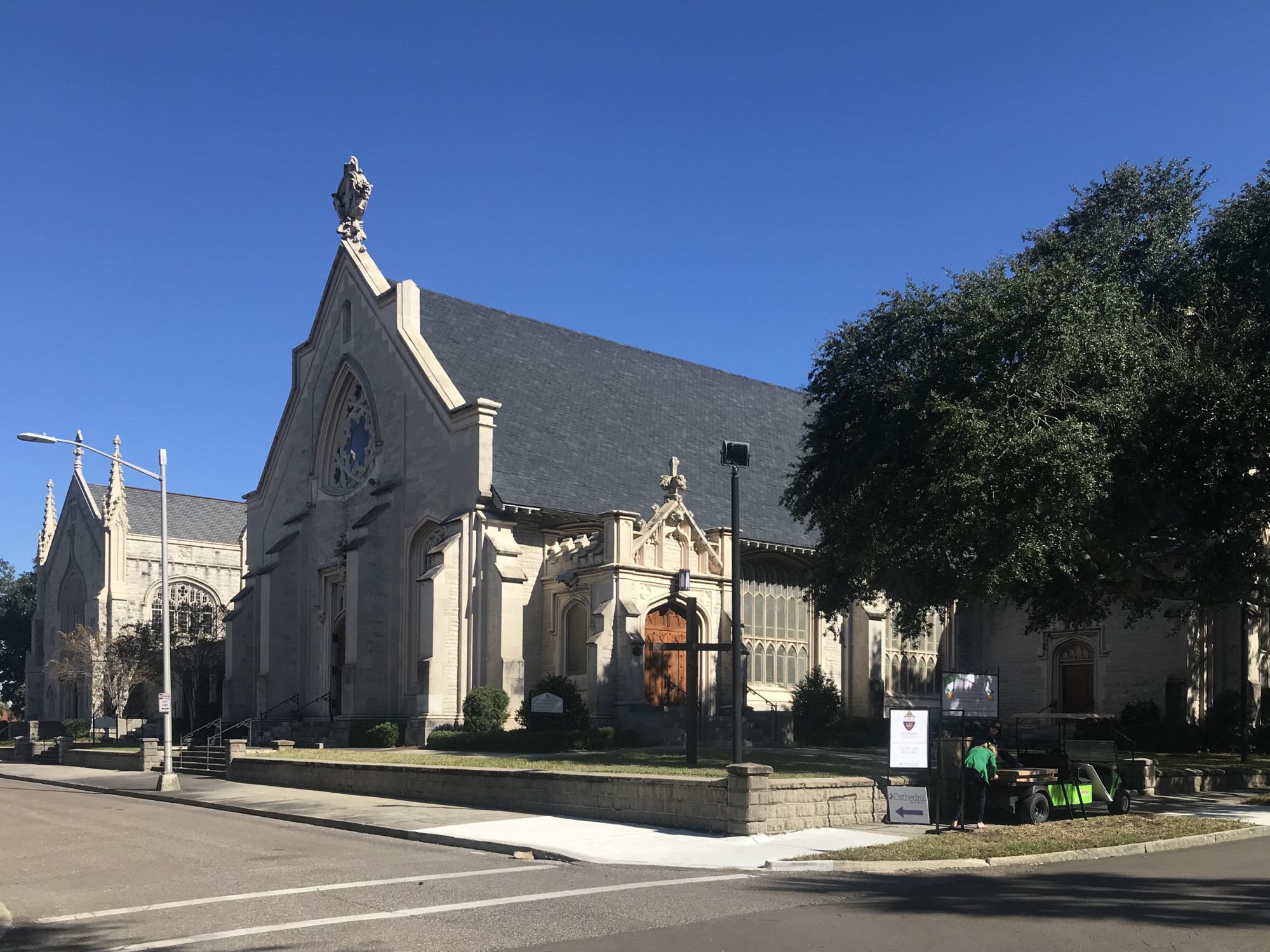 Workers set up signs in front of St. John's Episcopal Church.