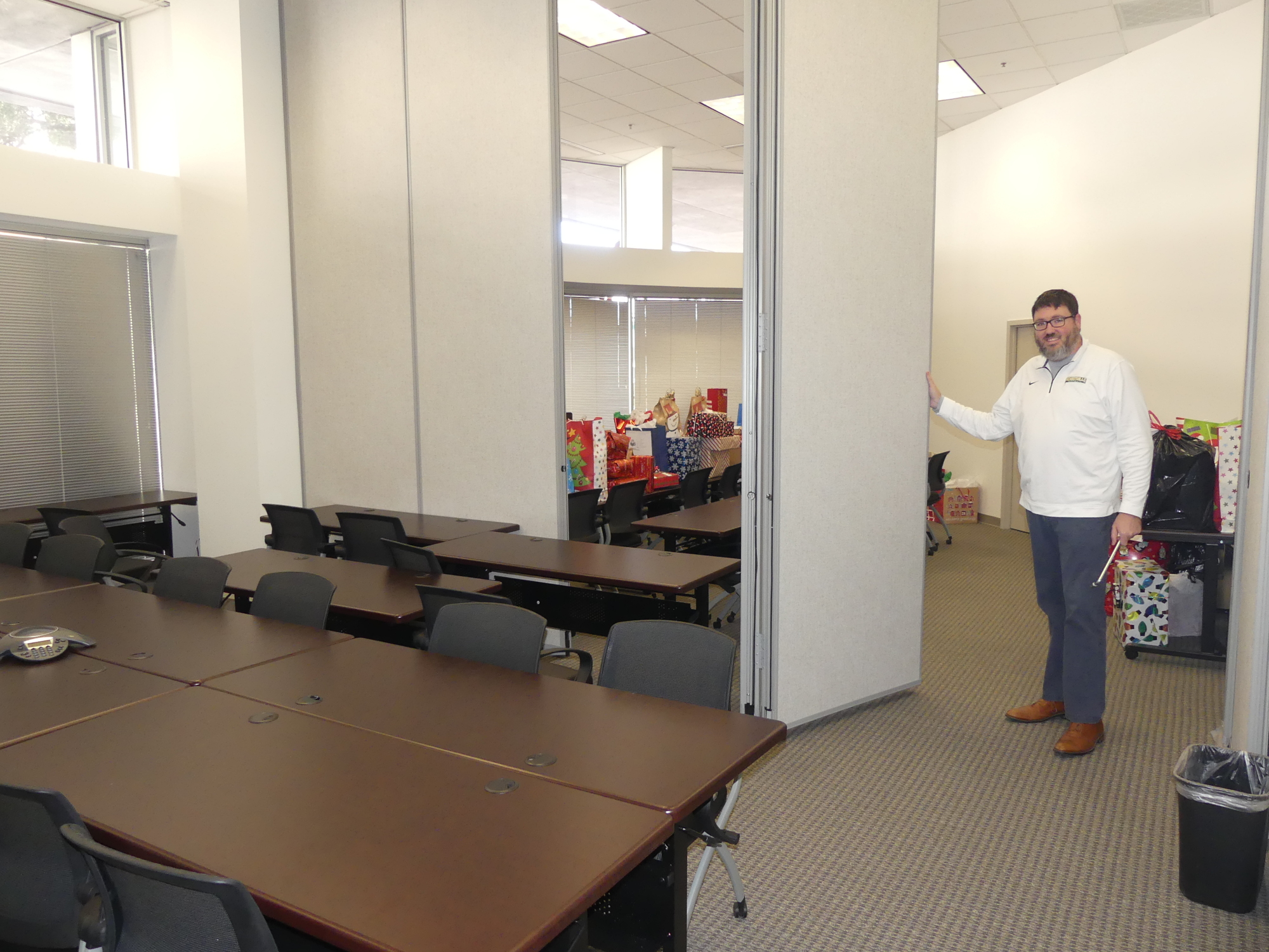 Jacksonville Bar Association Executive Director Craig Shoup setting up the flexible conference space at the association’s new offices to accommodate two simultaneous meetings.