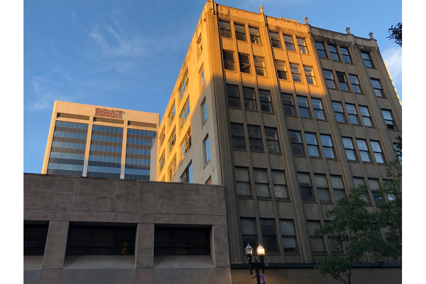 The Exchange building is at the right, with the Hogan Building at the left. The BB&T Tower looms behind it. Ash Properties owns the buildings.