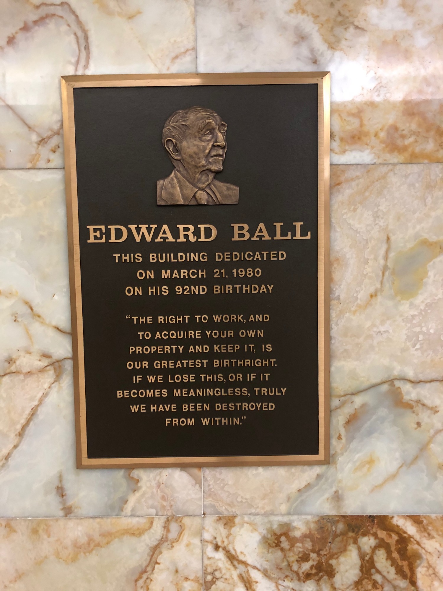 This bronze plaque hangs on the second-floor of the city-owned Downtown Edward Ball Building.