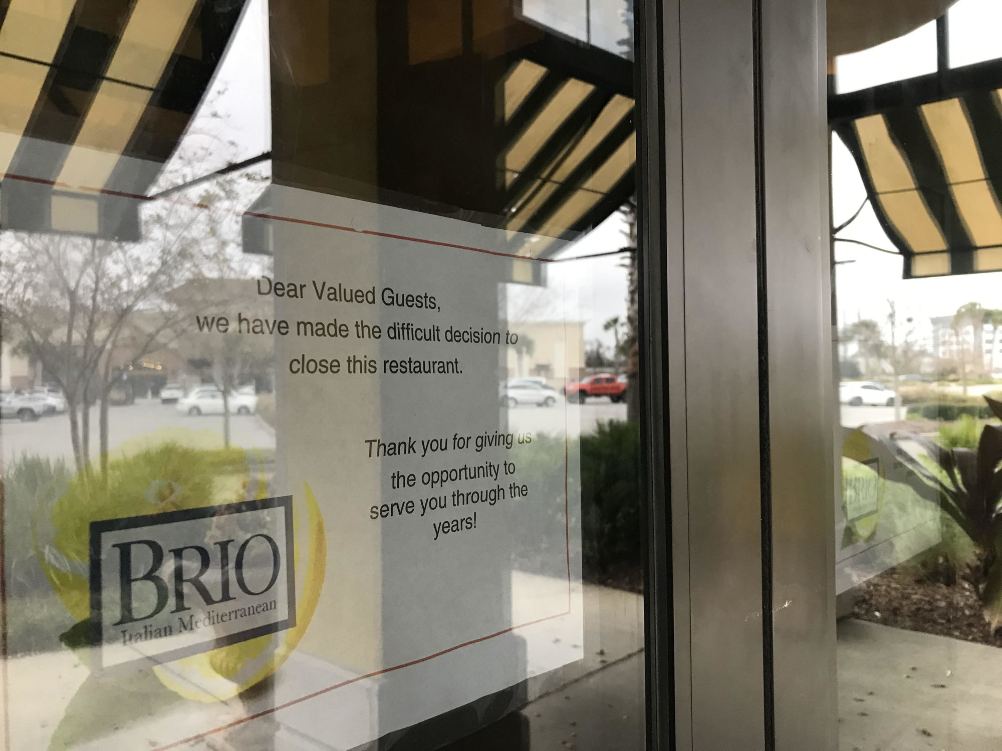 A sign was posted on the front door of the restaurant.