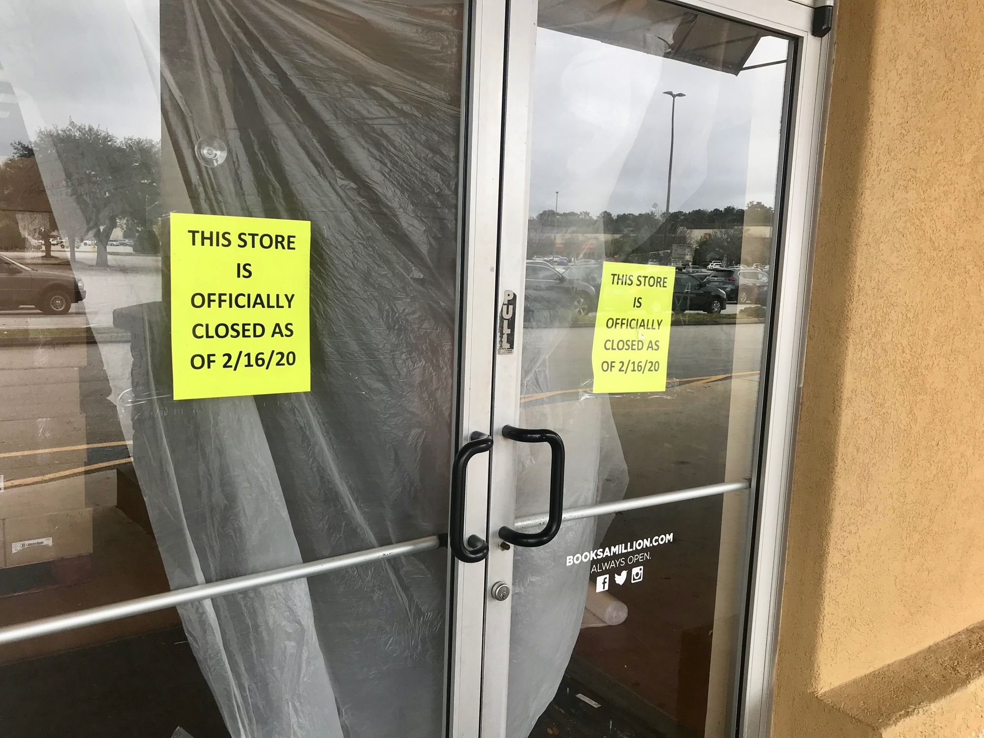 A sign in the door of the former Books-A-Million says the store is closed.