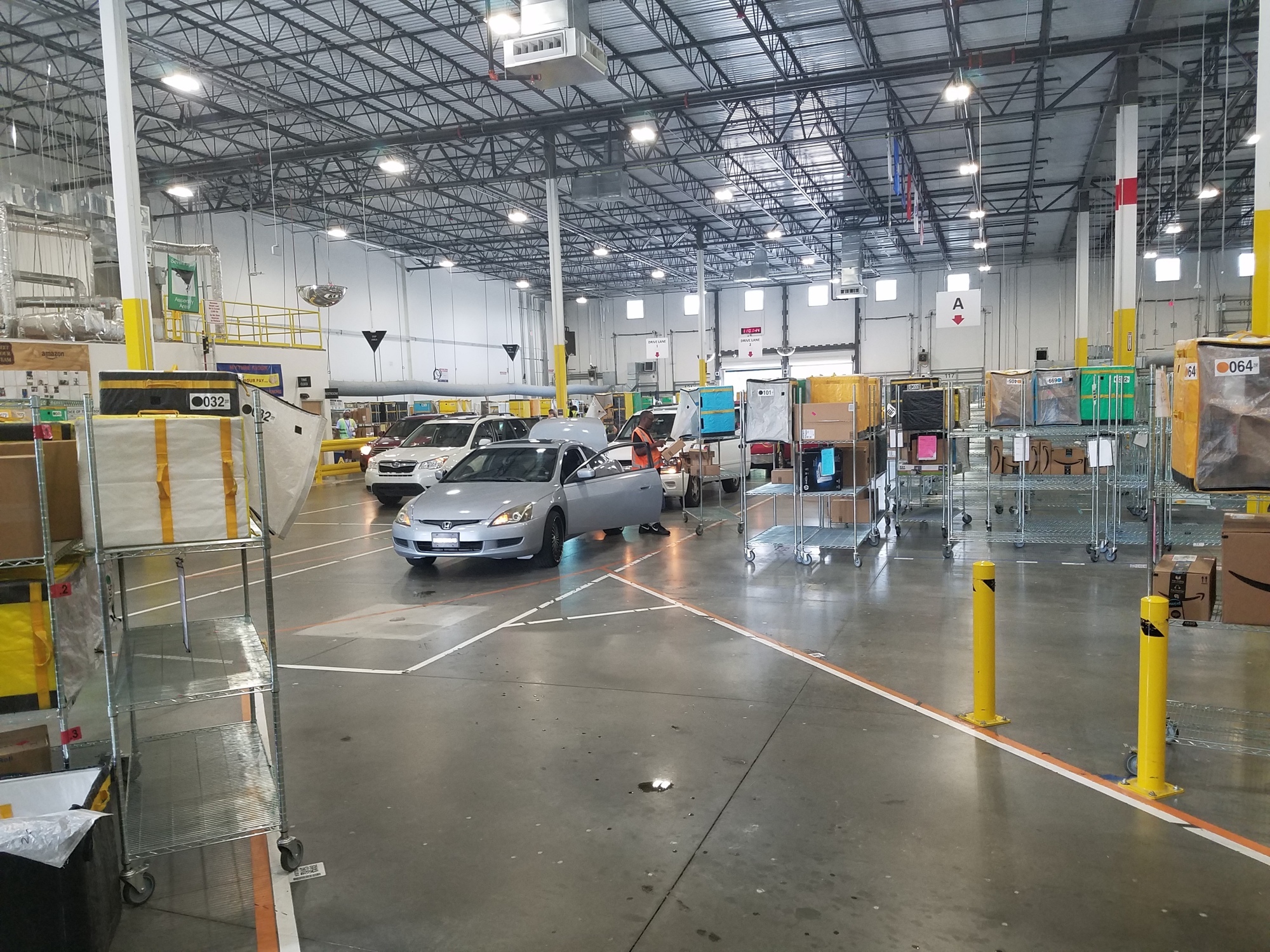 Cars pass through the Amazon delivery station in North Jacksonville.
