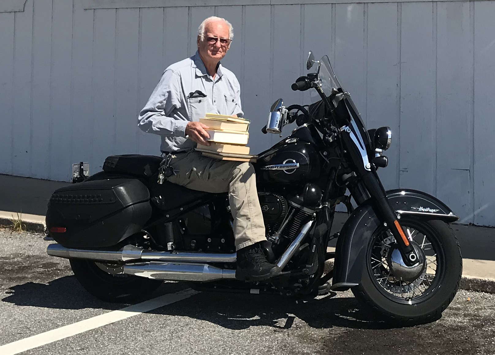 Ron Chamblin is doing some local deliveries on his Harley-Davidson motorcycle.