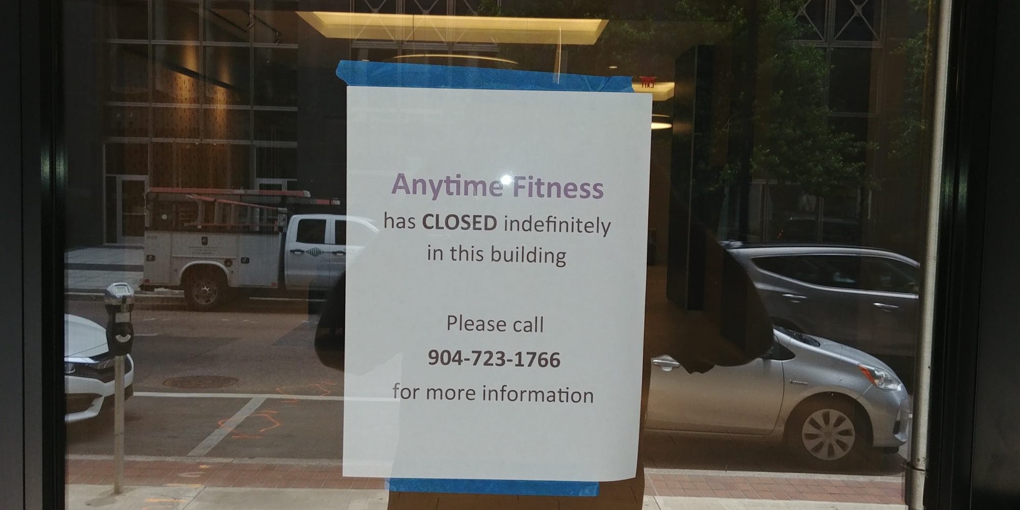 A sign in the window says the gym has closed indefinitely, but it will not be returning to the Laura Street building.