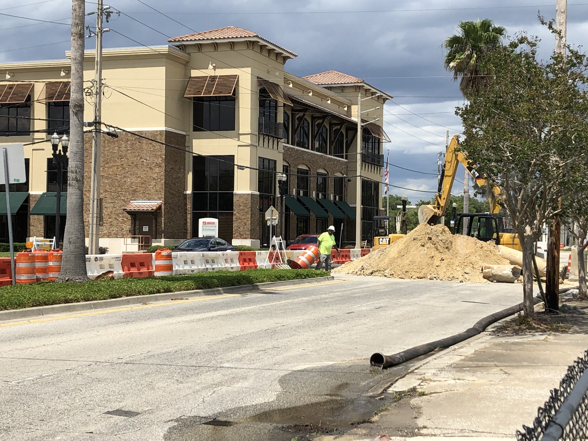 Workers dig at the East San Marco site across Atlantic Boulevard from the headquarters of Pet Paradise.