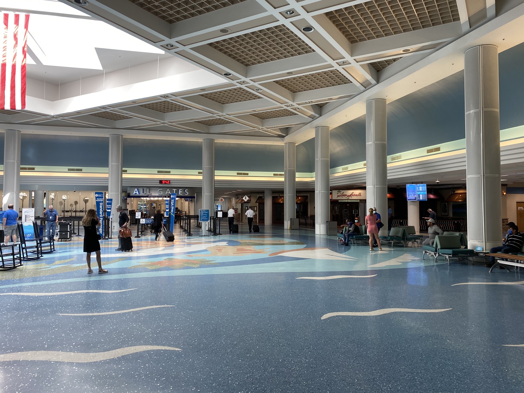 Most of the businesses inside the Jacksonville International Airport  entrance concourse are closed.