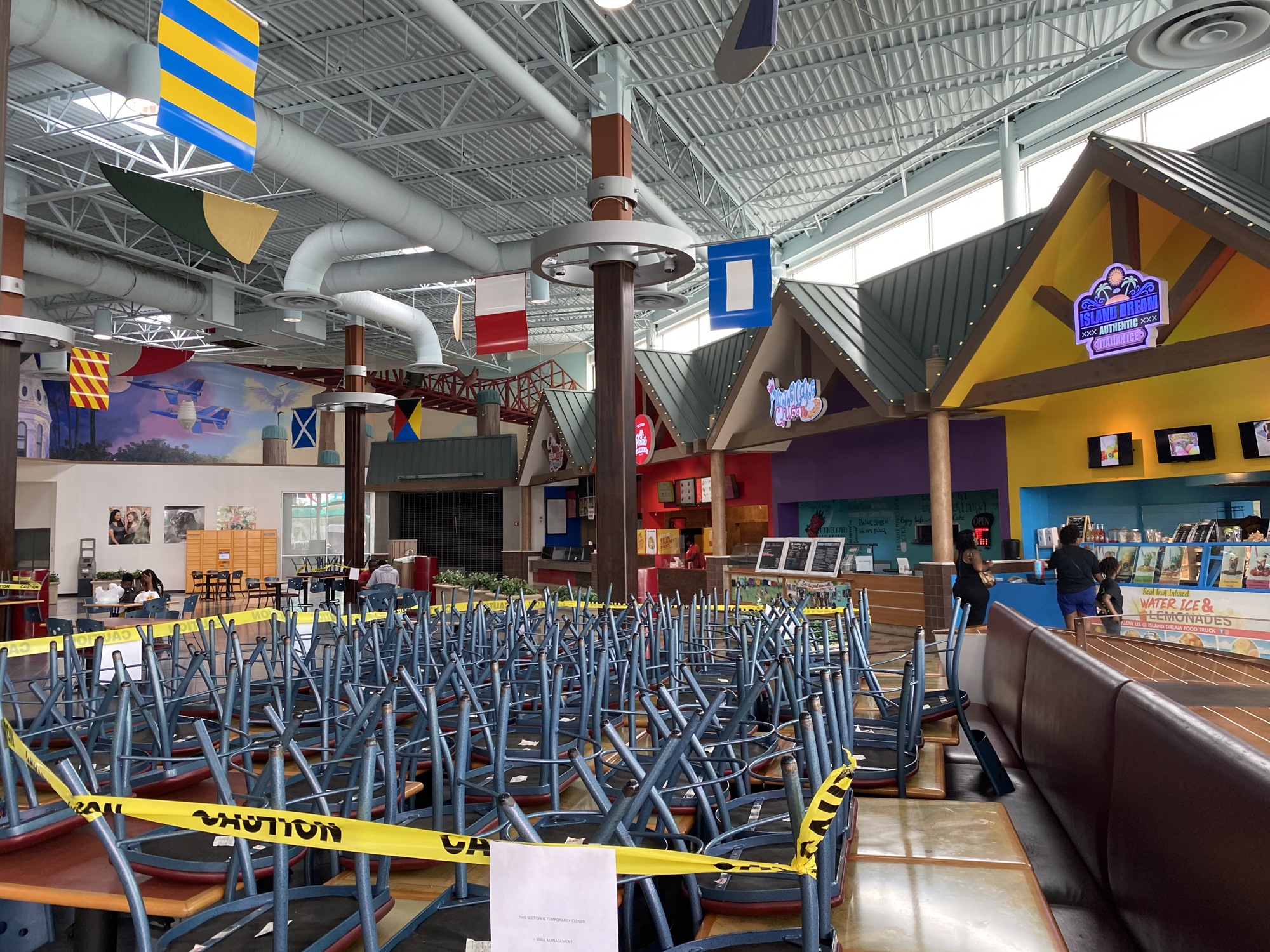 The food court at Regency Square Mall is open, but chairs are stacked to encourage social distancing because of COVID-19.